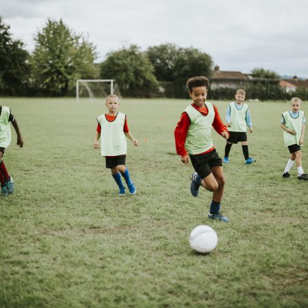 Junior football team playing on the field
