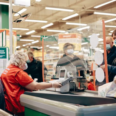 man-in-protective-medical-mask-buying-groceries-du-2024-12-05-05-47-40-utc